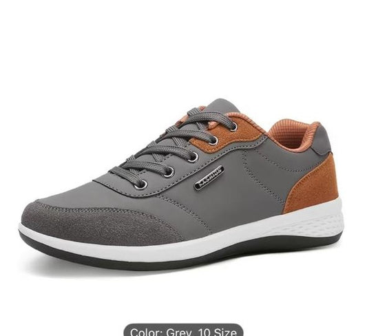 Gray and brown sneaker with white sole on a white background